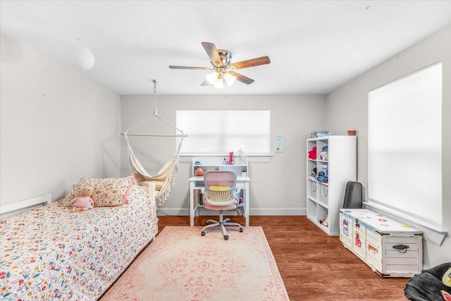612 W Park Ave, Weatherford, TX 76086 - bedroom featuring wood finished floors and a ceiling fan