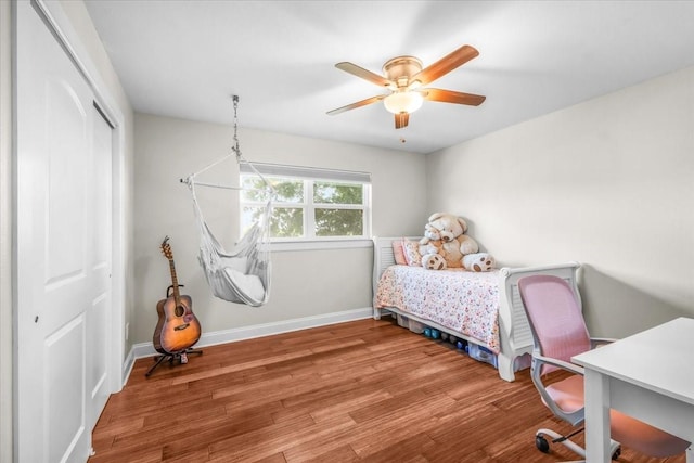 612 W Park Ave, Weatherford, TX 76086 - bedroom with a closet, wood finished floors, and a ceiling fan