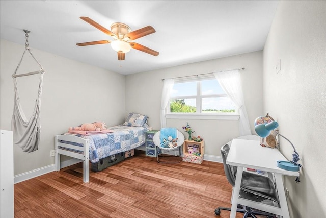 612 W Park Ave, Weatherford, TX 76086 - bedroom featuring wood finished floors and a ceiling fan