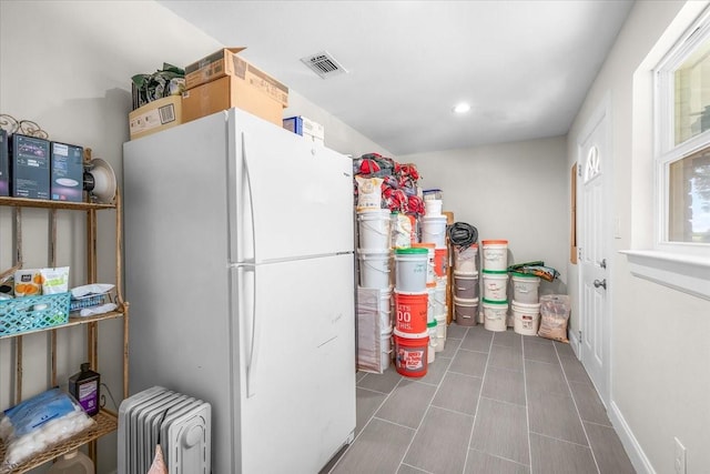 612 W Park Ave, Weatherford, TX 76086 - kitchen with freestanding refrigerator, recessed lighting, and tile patterned floors