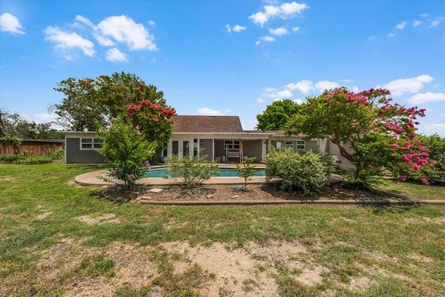 612 W Park Ave, Weatherford, TX 76086 - rear view of property featuring an outdoor pool