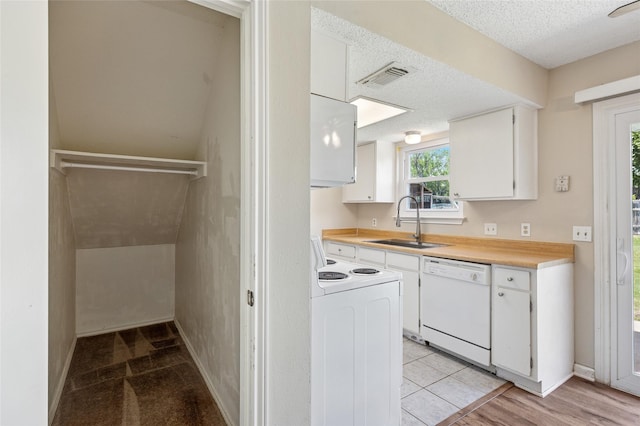 6569 Westridge Dr, Watauga, TX 76148 - kitchen featuring white appliances, a textured ceiling, white cabinets, and light countertops