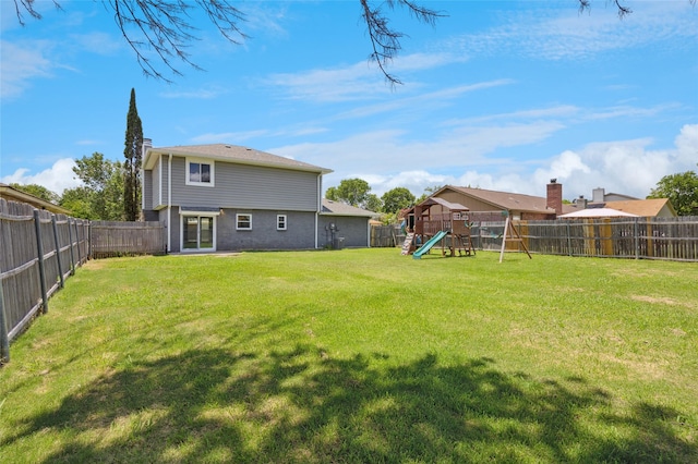 6569 Westridge Dr, Watauga, TX 76148 - rear view of house featuring a playground and a fenced backyard