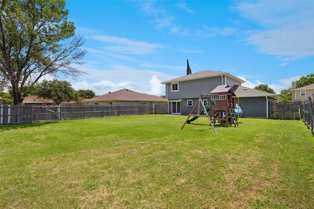 6569 Westridge Dr, Watauga, TX 76148 - rear view of property with a playground and a fenced backyard