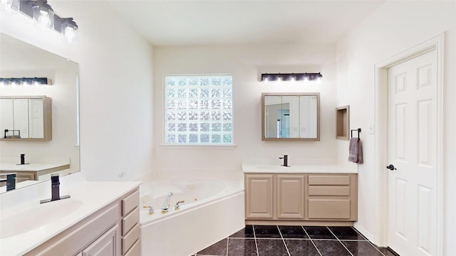 6218 Aspen Estates Dr, Sachse, TX 75048 - bathroom featuring two vanities, a jetted tub, and tile patterned floors
