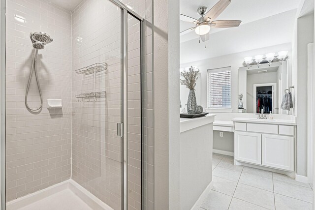 1813 Drover Creek Rd, Aubrey, TX 76227 - full bathroom with a stall shower, tile patterned floors, a walk in closet, and a ceiling fan