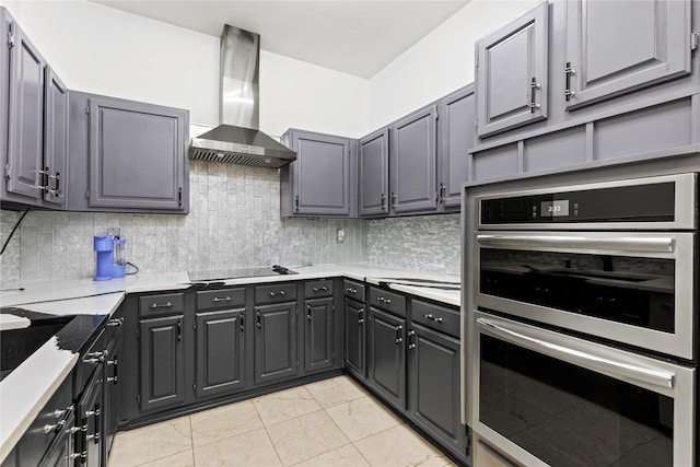 2707 Garden Springs Dr, Richardson, TX 75082 - kitchen featuring stainless steel double oven, island exhaust hood, tasteful backsplash, light countertops, and gray cabinets