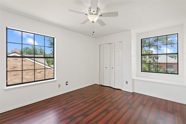 2707 Garden Springs Dr, Richardson, TX 75082 - unfurnished bedroom with dark wood-style flooring, a closet, and a ceiling fan