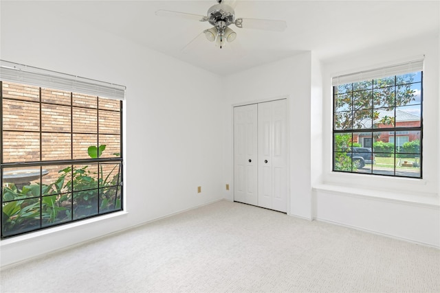 2707 Garden Springs Dr, Richardson, TX 75082 - unfurnished bedroom with carpet floors, a closet, and ceiling fan