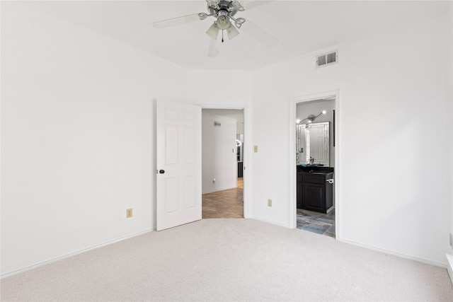 2707 Garden Springs Dr, Richardson, TX 75082 - unfurnished bedroom with light carpet, ensuite bathroom, and a ceiling fan