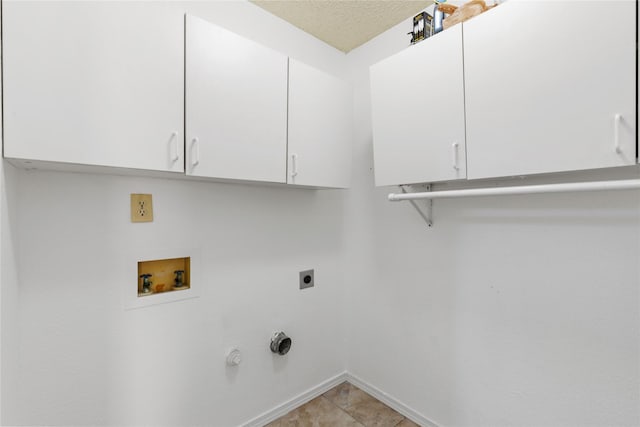 2707 Garden Springs Dr, Richardson, TX 75082 - laundry area featuring cabinet space, electric dryer hookup, and hookup for a washing machine