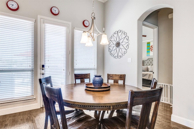 3300 Western Bluff Ct, Mansfield, TX 76063 - dining space with dark wood finished floors and arched walkways