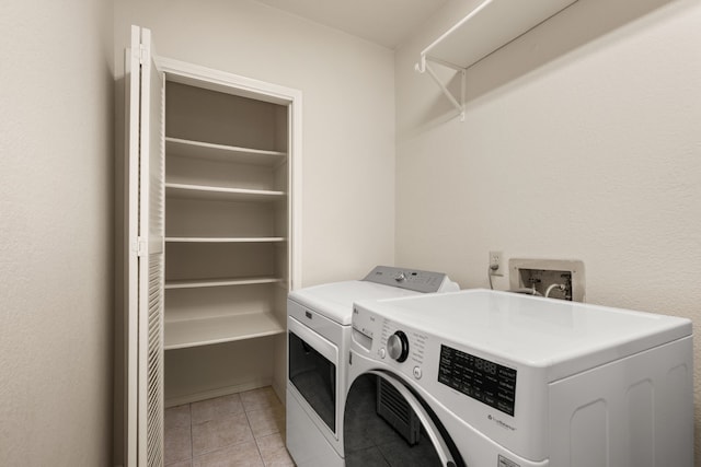 3312 John Ct N, Hurst, TX 76054 - laundry room with independent washer and dryer and light tile patterned flooring
