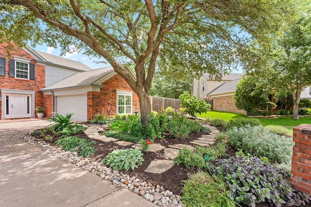 3312 John Ct N, Hurst, TX 76054 - view of front of home with brick siding, an attached garage, driveway, and a shingled roof