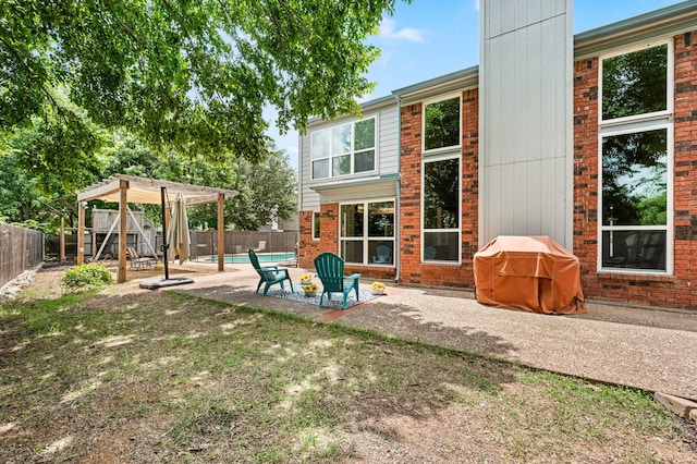 3312 John Ct N, Hurst, TX 76054 - back of house featuring a fenced backyard, a patio, and brick siding