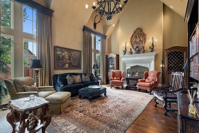 3048 Concord Pl, Tyler, TX 75701 - living room featuring high vaulted ceiling, dark wood-style flooring, a chandelier, a fireplace, and recessed lighting
