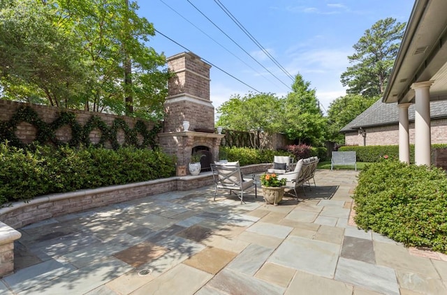 3048 Concord Pl, Tyler, TX 75701 - fenced backyard with an outdoor brick fireplace and a patio area