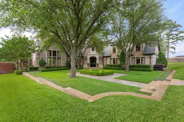 3048 Concord Pl, Tyler, TX 75701 - view of front of home with a front yard and brick siding