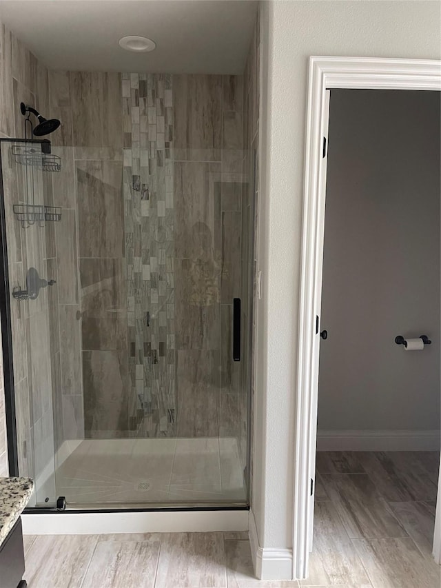 2314 Peggeys Cv, Sherman, TX 75092 - full bath with a shower stall, vanity, and wood finished floors