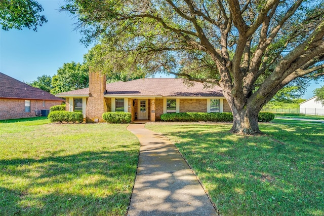 2917 Fladger St, Denton, TX 76207 - ranch-style home featuring a chimney and a front yard