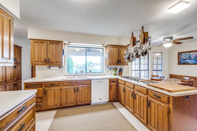 2917 Fladger St, Denton, TX 76207 - kitchen with white appliances, a peninsula, light countertops, and a ceiling fan