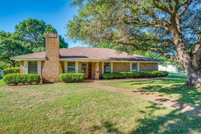 2917 Fladger St, Denton, TX 76207 - ranch-style home featuring a chimney, a front lawn, and brick siding