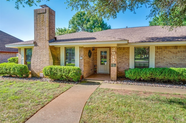 2917 Fladger St, Denton, TX 76207 - view of front of property featuring a chimney, brick siding, a front yard, and a shingled roof