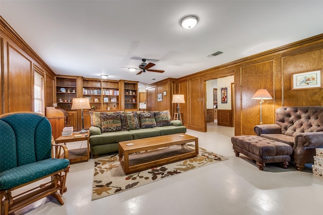 2917 Fladger St, Denton, TX 76207 - living area with finished concrete flooring, ceiling fan, and wood walls