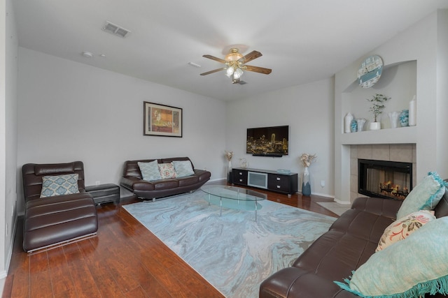 2625 Hudson Xing, Mckinney, TX 75072 - living room with ceiling fan, wood finished floors, and a tile fireplace