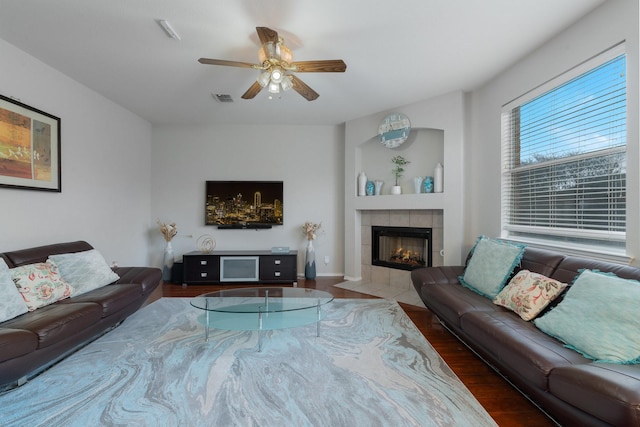 2625 Hudson Xing, Mckinney, TX 75072 - living area with wood finished floors, a ceiling fan, and a fireplace