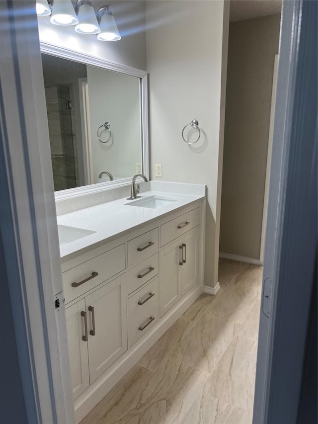 2625 Hudson Xing, Mckinney, TX 75072 - full bath with double vanity, marble look tiles, and a shower with shower door
