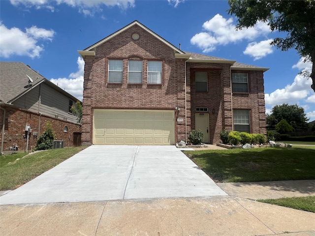 2625 Hudson Xing, Mckinney, TX 75072 - traditional-style home featuring a garage, a front yard, driveway, and brick siding