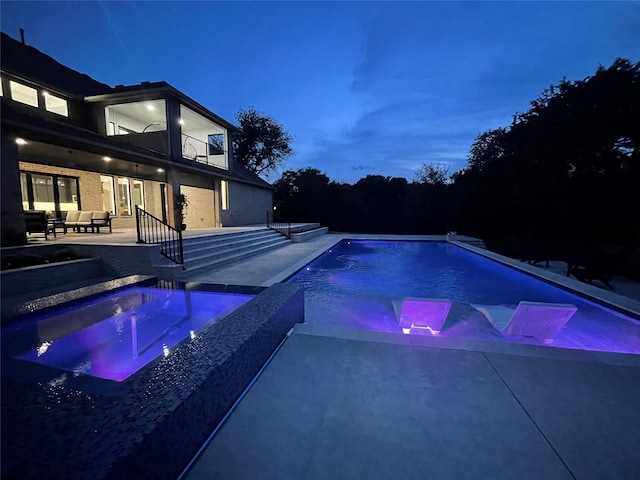 320 W Highland St, Southlake, TX 76092 - pool at twilight with an outdoor hangout area, a patio, an outdoor pool, and an in-ground hot tub