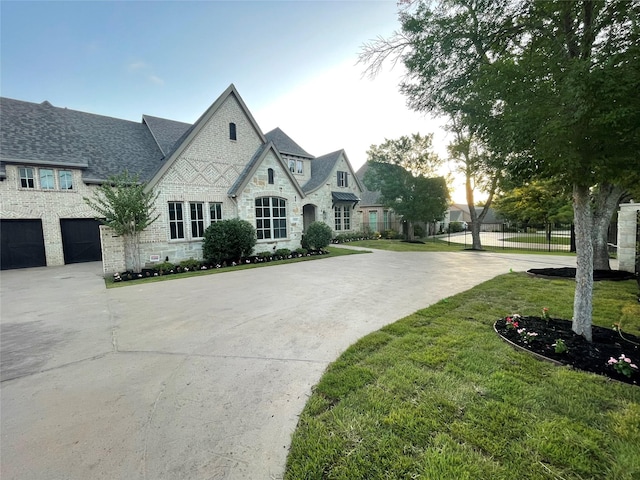 320 W Highland St, Southlake, TX 76092 - french country style house featuring stone siding and driveway