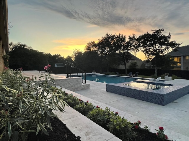 320 W Highland St, Southlake, TX 76092 - pool at dusk with a jacuzzi, an outdoor pool, and a patio area
