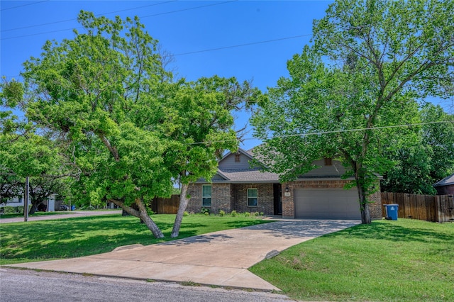 308 N 4th St, Gunter, TX 75058 - obstructed view of property with brick siding, an attached garage, and concrete driveway