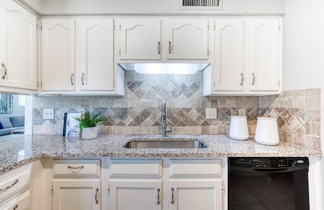 6005 Frontier Ln, Plano, TX 75023 - kitchen with dishwasher, white cabinetry, backsplash, and light stone counters