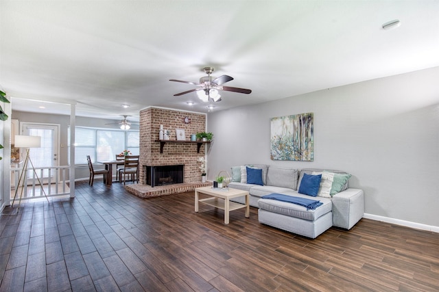 6005 Frontier Ln, Plano, TX 75023 - living area featuring a ceiling fan, dark wood-type flooring, and a fireplace