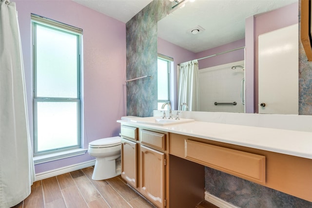 1301 Colmar Dr, Plano, TX 75023 - bathroom featuring vanity, a shower with shower curtain, and wood finished floors
