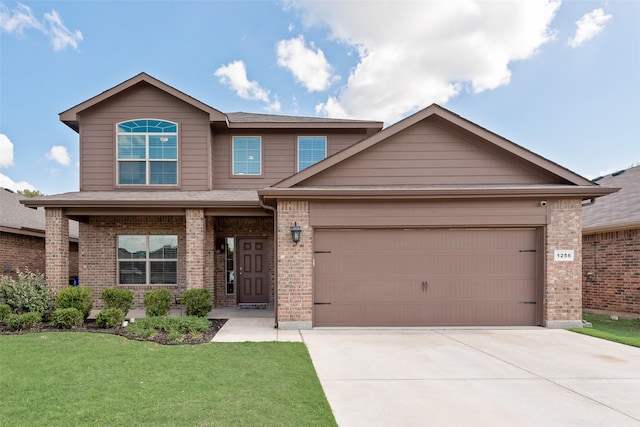 1256 Edgewater Dr, Azle, TX 76020 - view of front of property with brick siding, an attached garage, driveway, and a front lawn