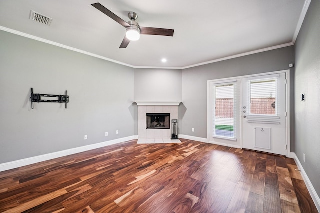 3900 Ironstone Ln, Mckinney, TX 75070 - unfurnished living room featuring wood finished floors, a ceiling fan, a tile fireplace, ornamental molding, and recessed lighting