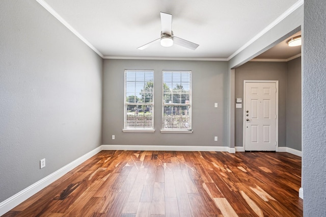 3900 Ironstone Ln, Mckinney, TX 75070 - spare room featuring crown molding, a ceiling fan, and dark wood-style floors