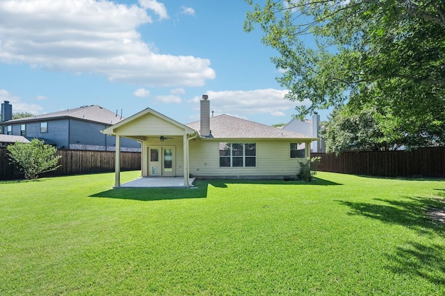 3900 Ironstone Ln, Mckinney, TX 75070 - back of property featuring a patio area, a fenced backyard, ceiling fan, and a chimney