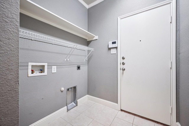 3900 Ironstone Ln, Mckinney, TX 75070 - laundry room with hookup for an electric dryer, hookup for a washing machine, light tile patterned floors, and gas dryer hookup