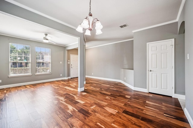 3900 Ironstone Ln, Mckinney, TX 75070 - empty room with dark wood-type flooring, a ceiling fan, crown molding, a chandelier, and arched walkways