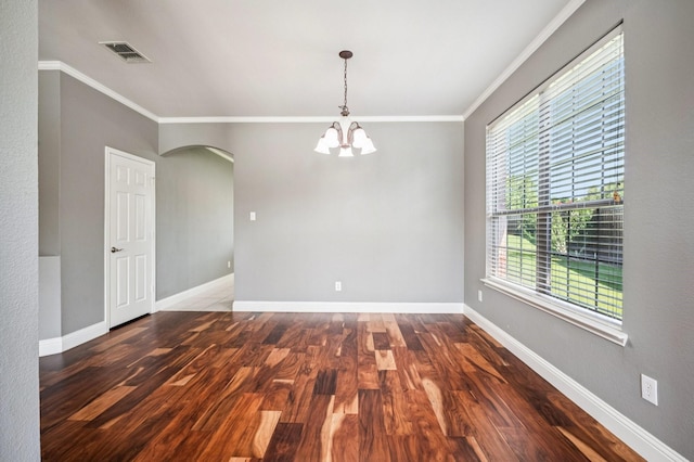 3900 Ironstone Ln, Mckinney, TX 75070 - unfurnished room featuring arched walkways, wood finished floors, ornamental molding, and a chandelier