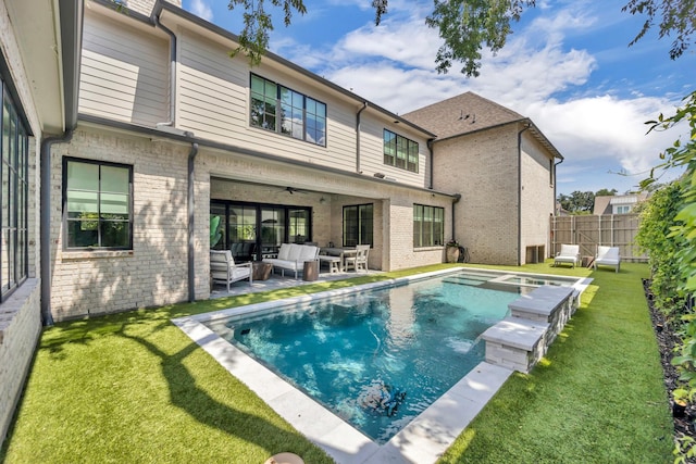 6819 Park Ln, Dallas, TX 75225 - rear view of house with an outdoor hangout area, brick siding, a ceiling fan, a patio, and a pool with connected hot tub