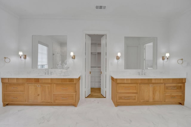 6819 Park Ln, Dallas, TX 75225 - bathroom with a stall shower, marble finish flooring, two vanities, and crown molding
