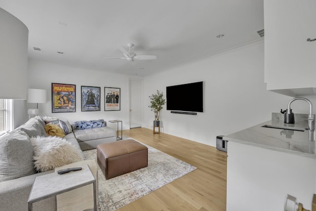6819 Park Ln, Dallas, TX 75225 - living area with light wood finished floors and a ceiling fan