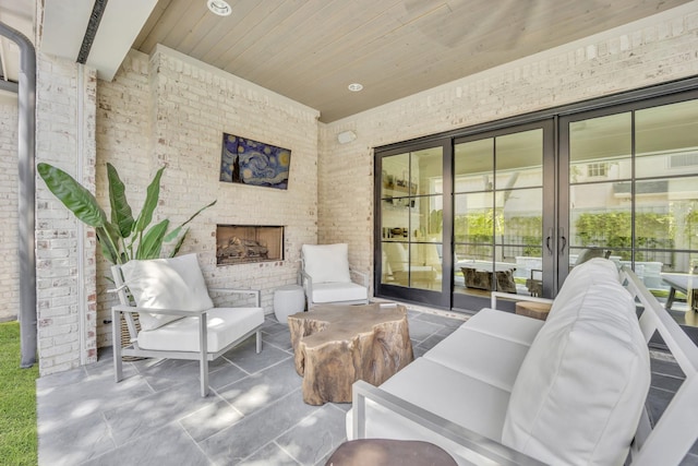 6819 Park Ln, Dallas, TX 75225 - view of patio / terrace with an outdoor living space with a fireplace and french doors